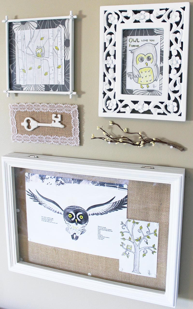 Vintage-inspired mounted key artwork as part of an owl gallery wall.