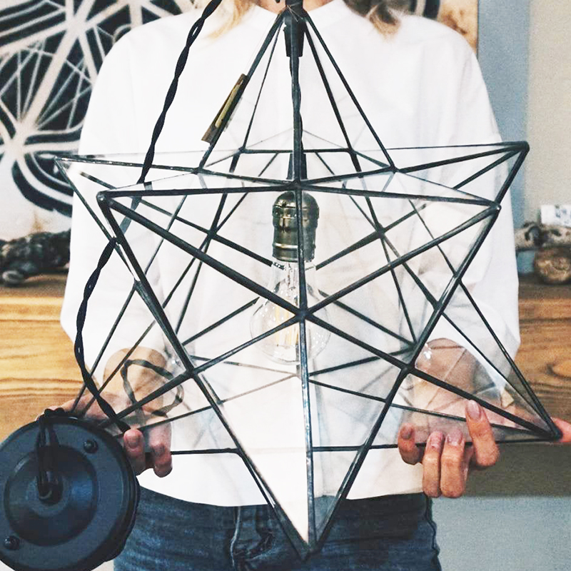 Looking for modern farmhouse light fixtures? Well, these five beauties are the real deal as they were all handmade! Like this glass star pendant by GEOMETRICGLASSplace.