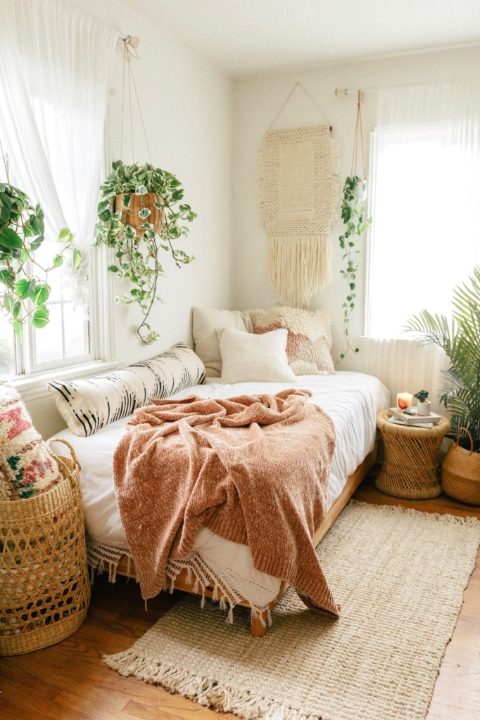 If you love the look of a boho bedroom like this one by Black and Blooms, check out a bohemian bedroom decor shopping guide on Of Houses and Trees - featuring eco-conscious items from ethical marketplace Made Trade.