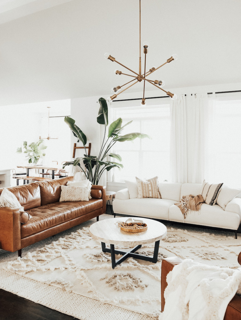 Here's how to create a modern boho living room, which balances the funky boho vibe with clean lines and neutral colours - like this one featured on The Every Mom.