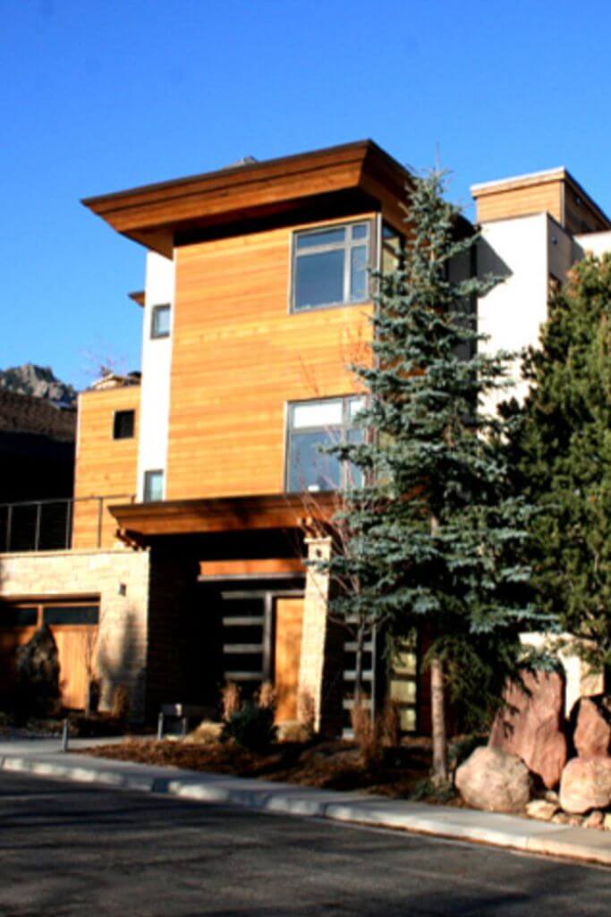 A modern home with red cedar siding.