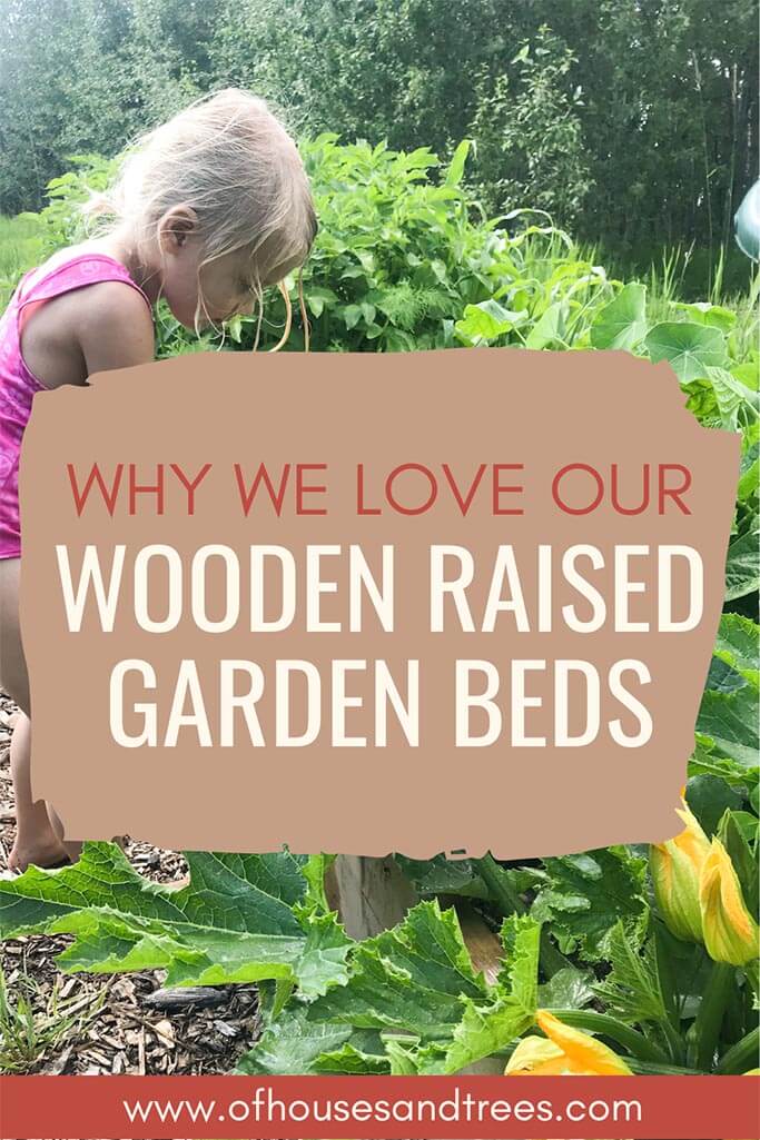 A little girl in a lush garden with text why we love our wooden raised garden beds.