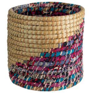 Woven basket with a colourful stripe on a white background.