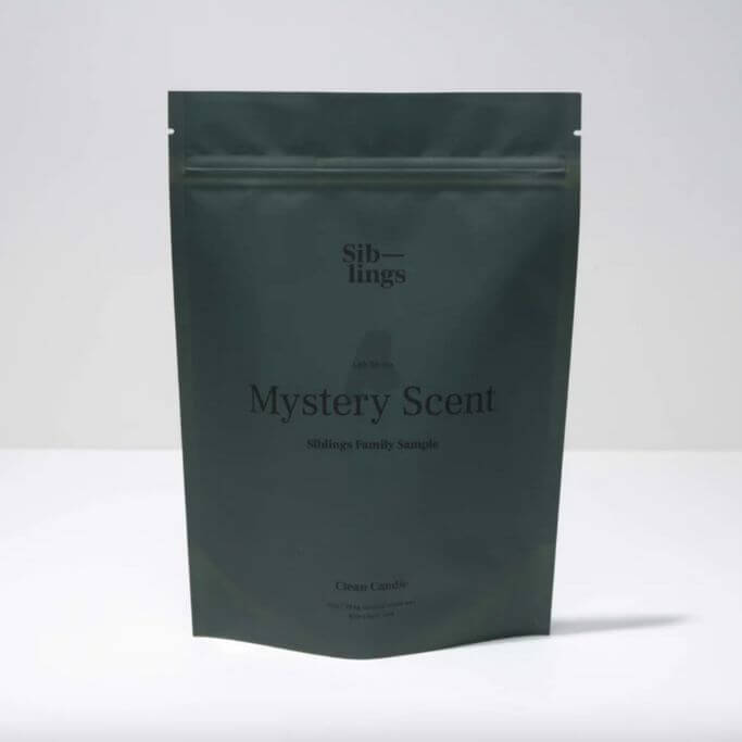 A grey package on a white background with label "mystery scent."