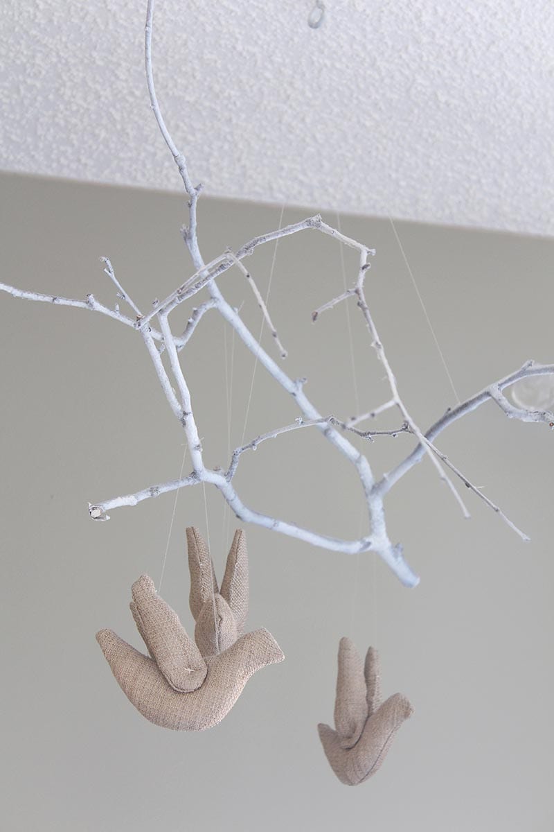 If you're looking for eco-friendly DIY projects, try this tree branch mobile. Using elements of nature in your decor is one way to green your home. Just make sure to use an eco-friendly paint for the branch and a natural fabric for the stuffed birds.