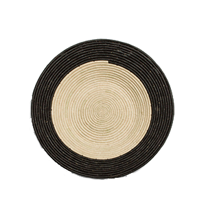 Whether your decor style is Boho, Coastal - even Minimalist - there's a set of woven basket wall decor out there with your name on it! And you can start with the Dipped Black + Natural Raffia Basket from ethical brand KAZI.