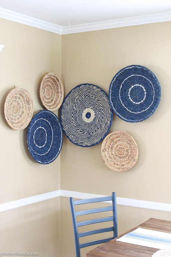 This basket wall from Green with Decor is a beautiful example of how to use woven basket wall decor in a coastal-styled home.