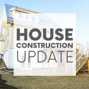 A yellow house with a silver roof surrounded by dirt with the words "house construction update." Click to visit post.