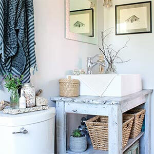 A bright bathroom with various rustic decor items.