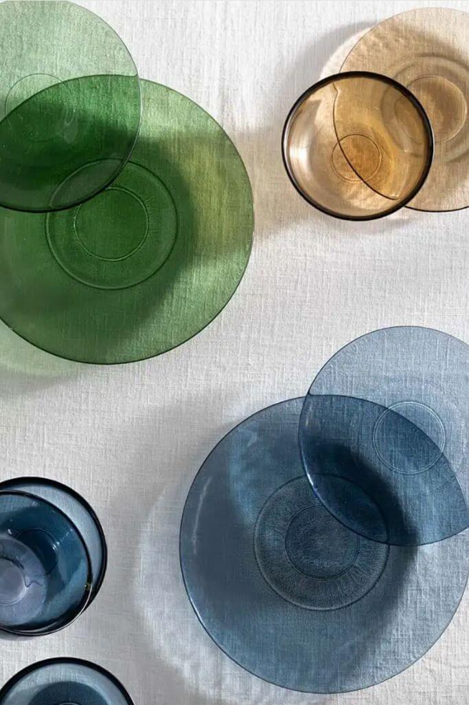 Blue, green and yellow glass plates and bowls.