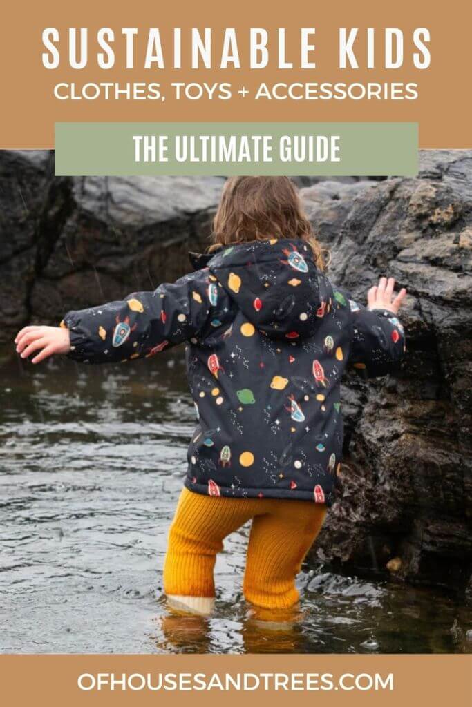 A little girl playing in a stream with text sustainable kids clothes, toys + accessories.