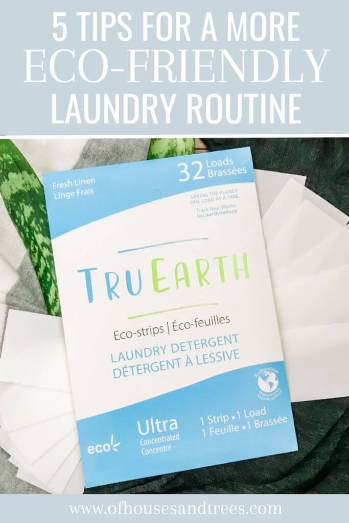 Laundry, laundry strips and green leaves on the floor with text 5 tips for a more eco-friendly laundry routine.