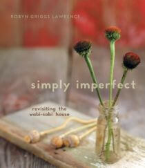 Book cover of Simply Imperfect featuring a photo of red flowers in a glass jar on a rustic wooden table.