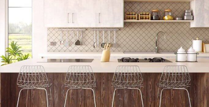 White and wood kitchen with silver barstools and vintage accessories.