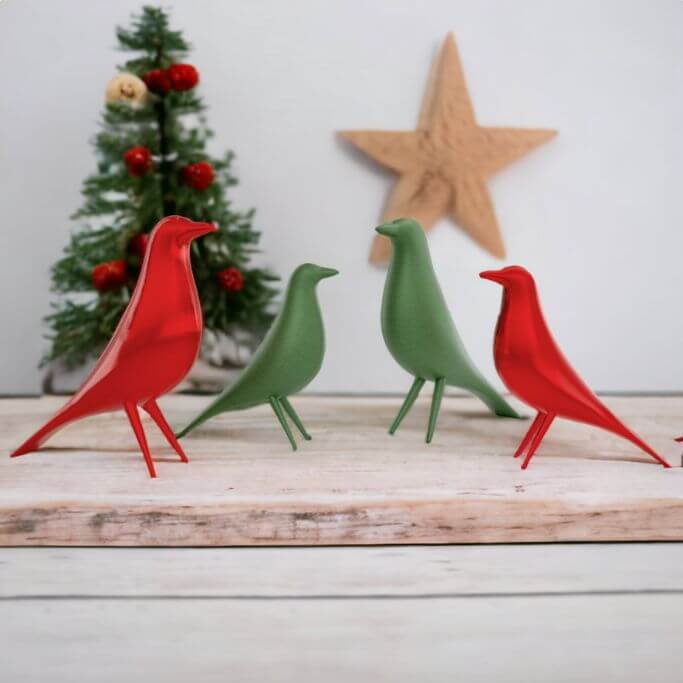 Two red and two green minimalistic holiday bird decor.