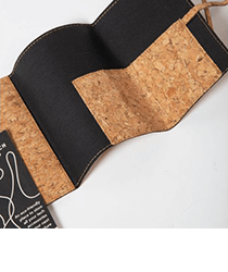 A black fabric and cork fold-out wallet.