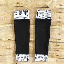 Handmade Baby and Toddler Leg Warmers via Etsy Black and white baby leg warmers on a wooden background. Click to visit Etsy website.