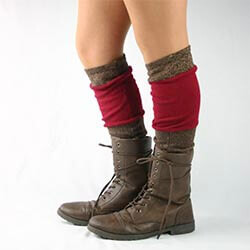 Handmade Upcycled Leg Warmers via Etsy A closeup of a pair of legs wearing red and brown knee-high leg warmers and brown boots. Click to visit Etsy website.