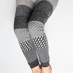 Handmade Thigh-High Leg Warmers via Etsy A closeup of a pair of legs wearing grey and white patterned leg warmers. Click to visit Etsy website.