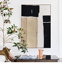 MINTED<br />
Artwork A piece of black, white and beige abstract art hanging in front of a coffee table.