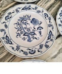 Blue and white vintage plates on a marble background.