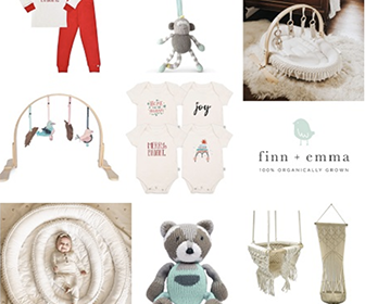 Various baby items such as onesies, a play mat, a stuffed bear and a macrame swing on a white background with the words "Finn + Emma 100% organically grown." Click to visit the Finn + Emma website.
